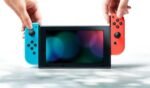 Consola Nintendo Switch negra con mandos Joy-Con derecho de color rojo neón - Imagen 5