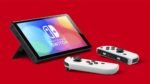 Nintendo Switch (modelo OLED) con base y mandos Joy-Con blancos. - Imagen 6